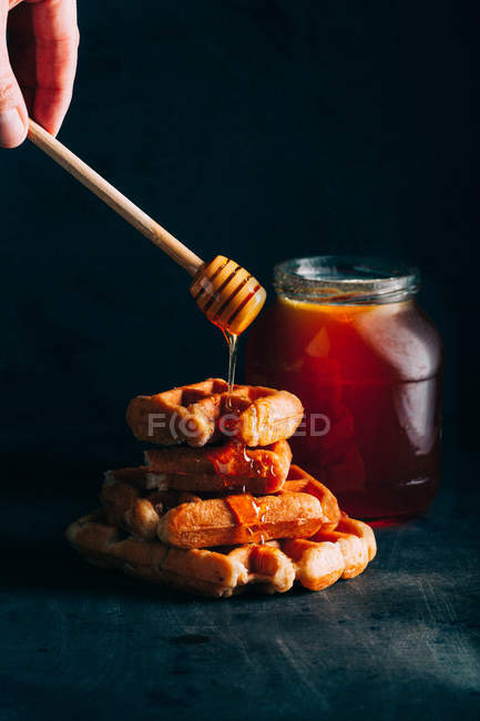 Belgian waffles with honey — Stock Photo