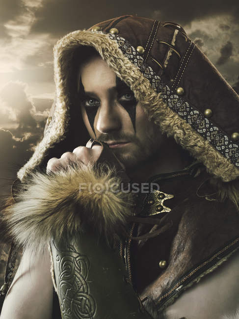 Medieval wanderer in sheepskin coat — Stock Photo