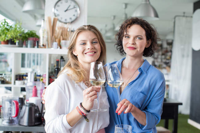 Beautiful women with glasses of champagne — Stock Photo