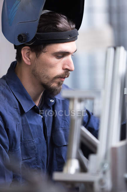 Man looking at iron details — Stock Photo
