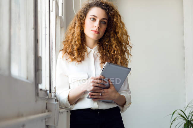 Confident businesswoman in office — Stock Photo