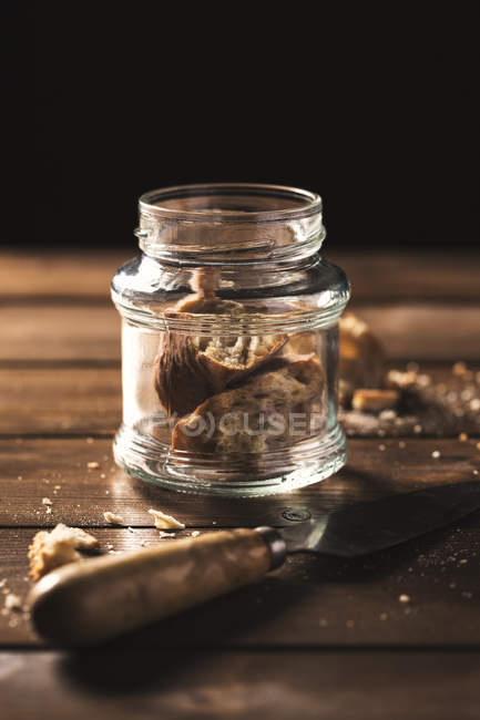 Pieces of bread inside glass can — Stock Photo