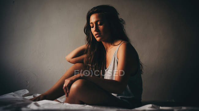 Beautiful young woman in grey — Stock Photo