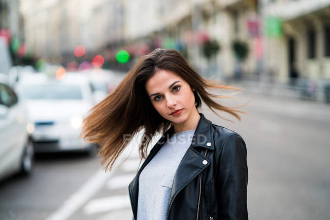 Young woman posing in street — Stock Photo