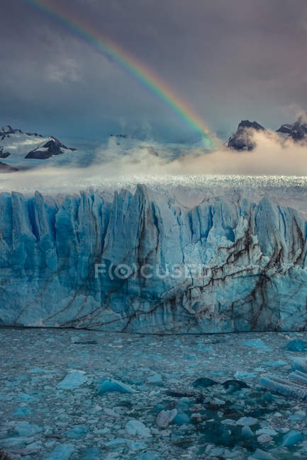 Rainbow above glacier — Stock Photo