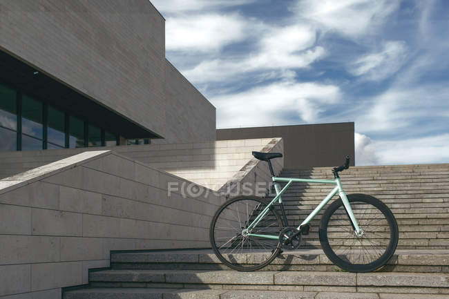 Modern bike on steps — Stock Photo