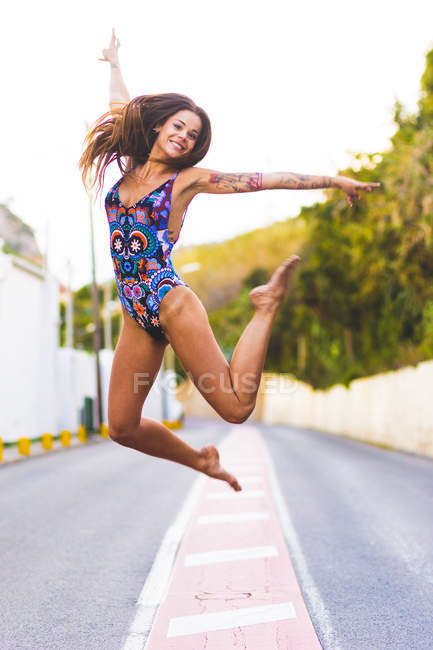 Woman with long hair in swimsuit — Stock Photo