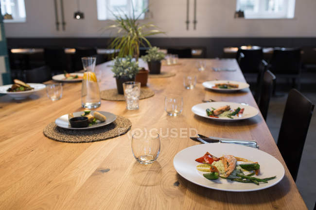 Close up view of served plates on table at cafeteria — Stock Photo