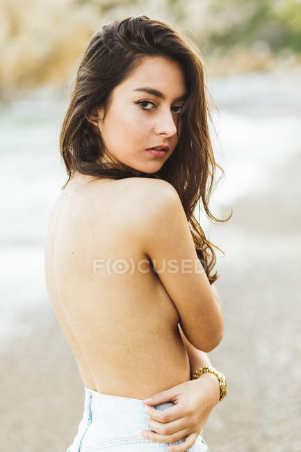 Topless girl in looking over shoulder — Stock Photo