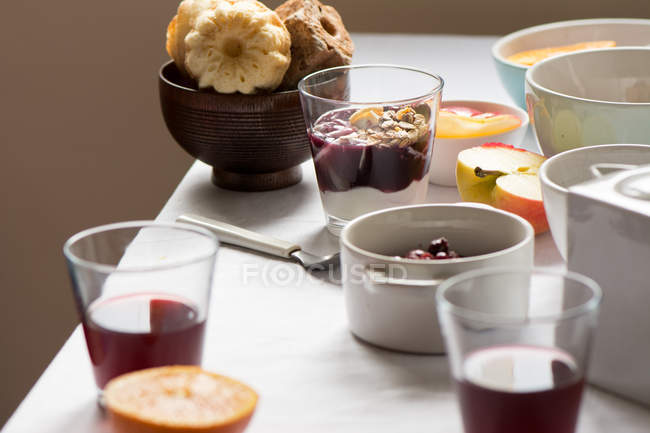 Breakfast table with yoghurt — Stock Photo