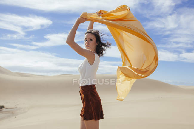 Woman in sand dunes — Stock Photo