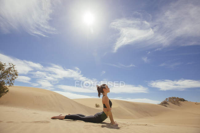 Side view of woman stretching body — Stock Photo