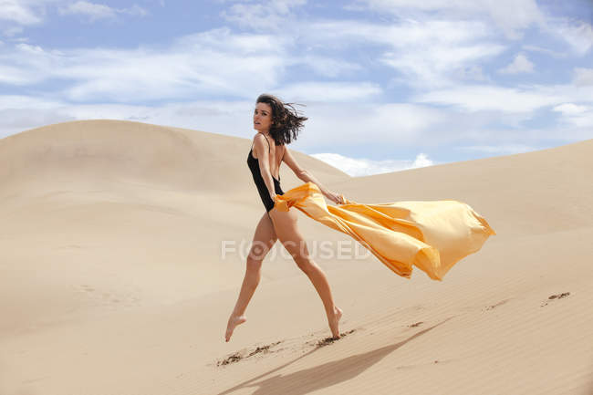 Sensual woman in dunes — Stock Photo