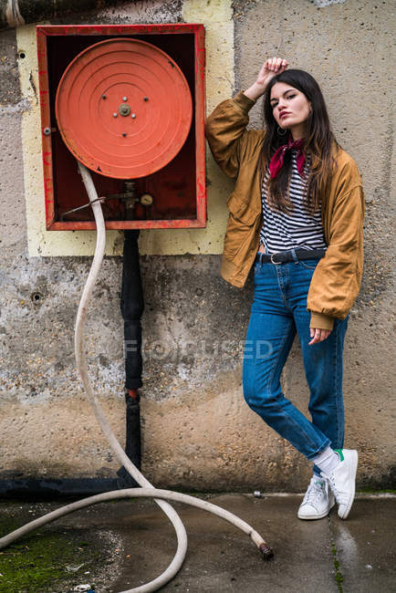 Young cute girl near fire hydrant — Stock Photo
