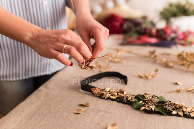 Person making beautiful handmade headdress — Stock Photo