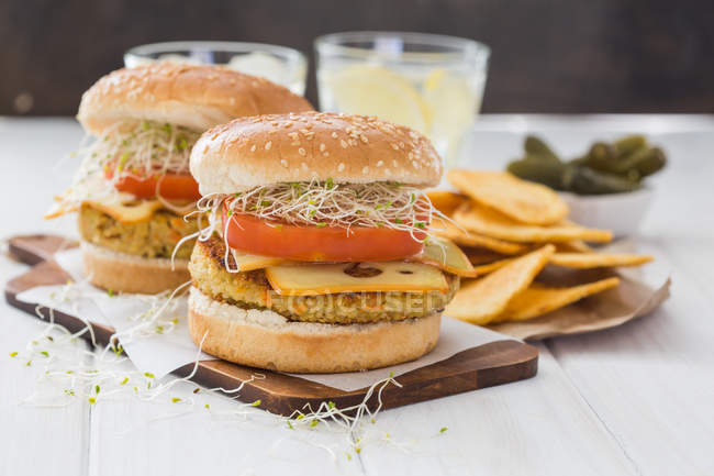 Vegan burger with quinoa, tomato and sprouts — Stock Photo