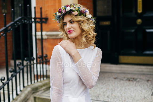 Elegant bride touching shoulder — Stock Photo