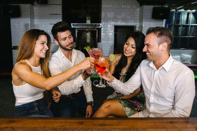 Friends toasting in bar — Stock Photo