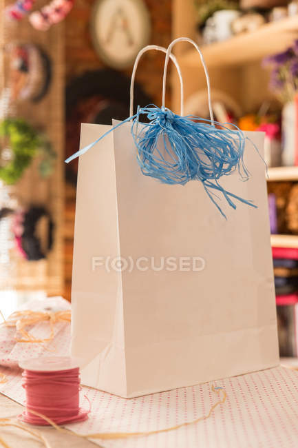 Decorated bag on table in workshop — Stock Photo
