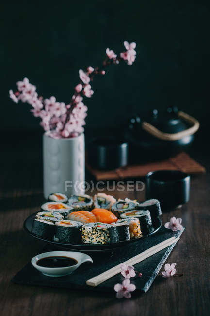 Sushi served on wooden table — Stock Photo