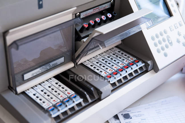 Medical test machine with loaded test tubes — Stock Photo