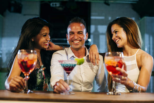 Laughing friends in bar — Stock Photo