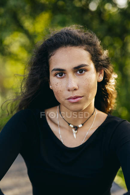 Beautiful young curly girl outside — Stock Photo