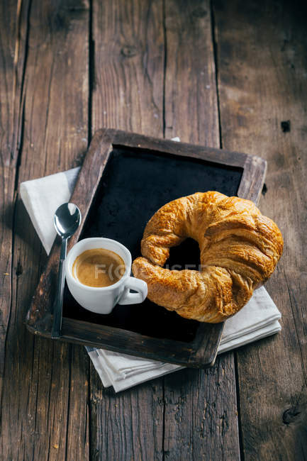 Espresso coffee cup and croissant — Stock Photo