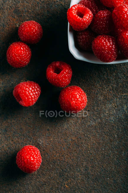 Raspberries on grunge — Stock Photo