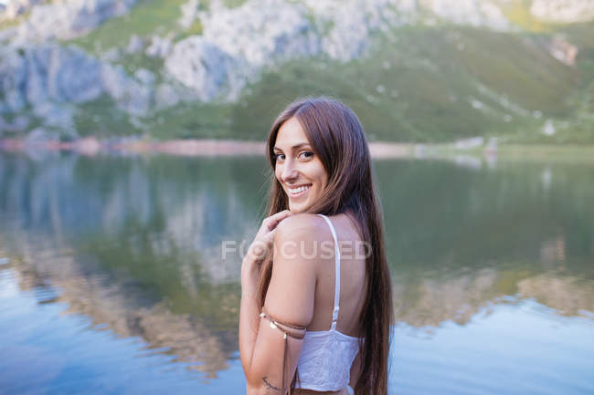 Young girl posing in white dress — Stock Photo