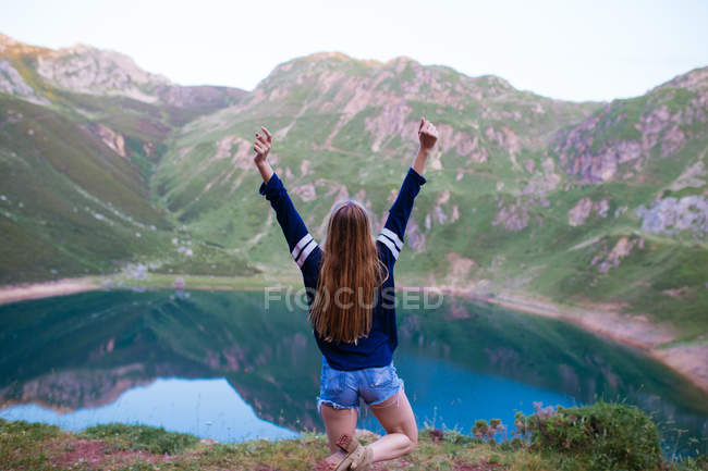 Girl standing on knees and stretching — Stock Photo