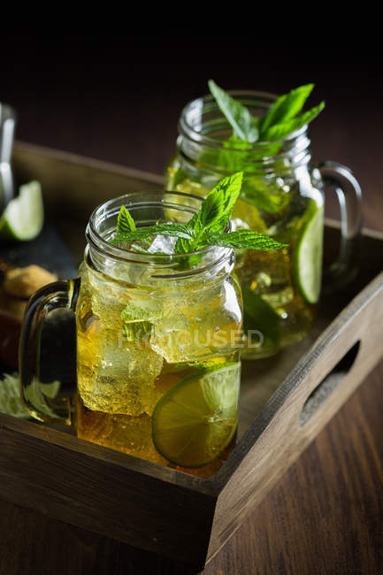 Mojito in mason jar on wooden table — Stock Photo