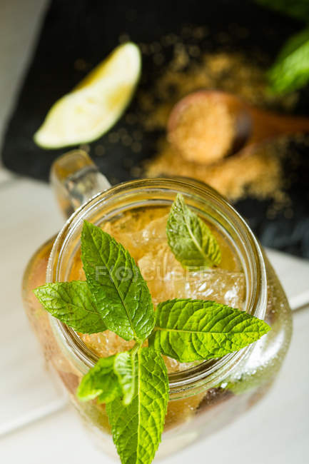 Mojito in mason jar on wooden table — Stock Photo