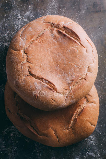 Rustic bread on dark — Stock Photo