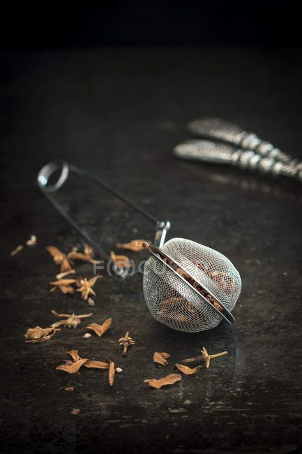 Tea composition with tea strainer — Stock Photo