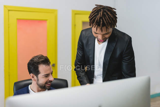 Portrait of multi ethnic colleagues at workplace — Stock Photo