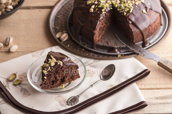 Piece of chocolate cake with ganache — Stock Photo