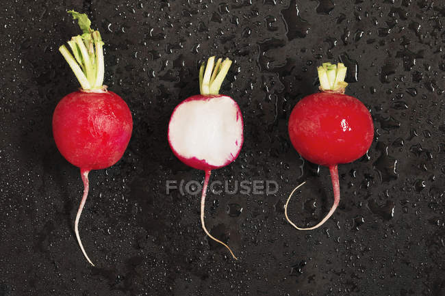 Three red radishes — Stock Photo