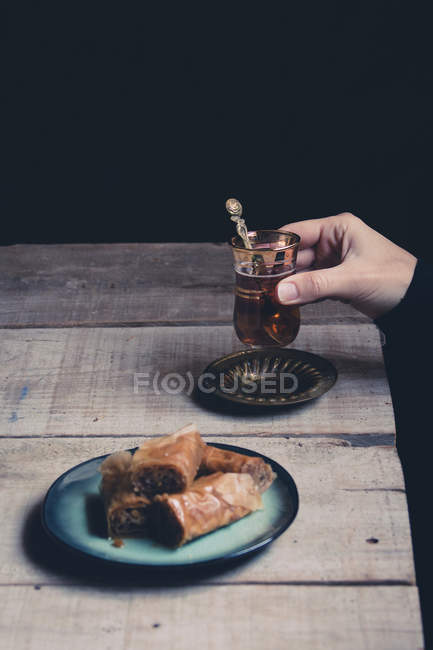 Cup of tea with sweet pastry — Stock Photo