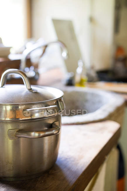 Pan on table in kitchen — Stock Photo