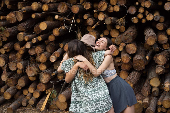 Three girls embracing — Stock Photo