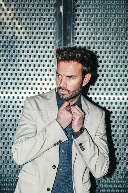 Young Sexy Man Against a Metallic Wall — Stock Photo
