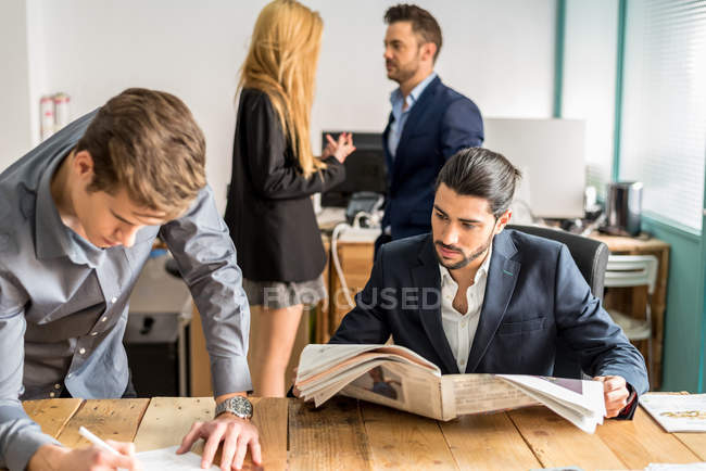 Work scene of business people in trendy office — Stock Photo