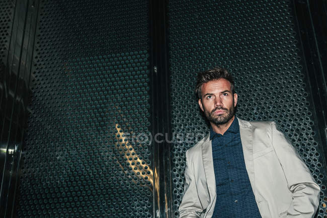 Young Sexy Man Against a Metallic Wall — Stock Photo