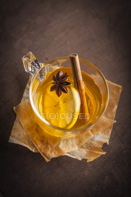 Cup of tea with lemon and anisse — Stock Photo