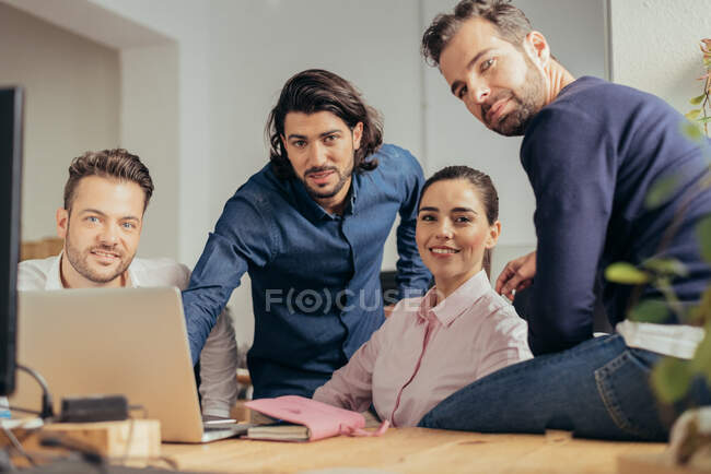 Multi-ethnic business people working in a trendy office — Stock Photo