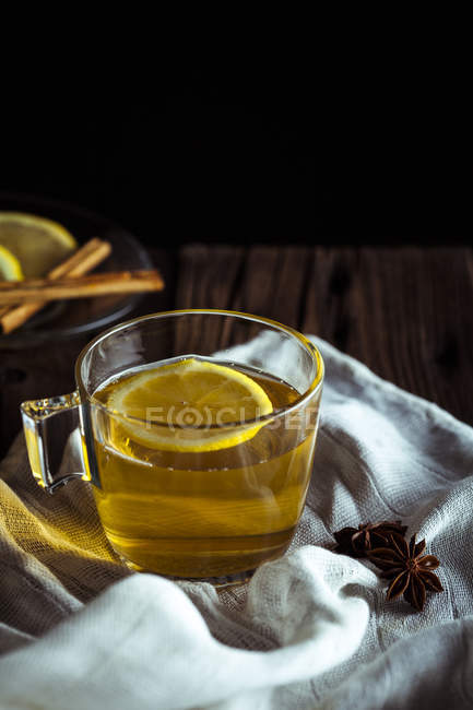 Cup of tea with lemon and anisse — Stock Photo