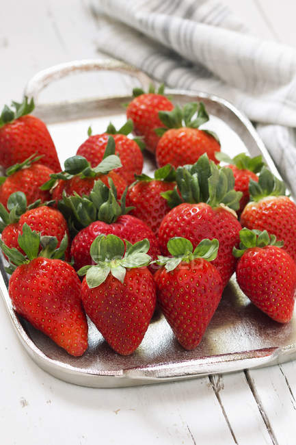 Strawberries in spring in silver plate — Stock Photo