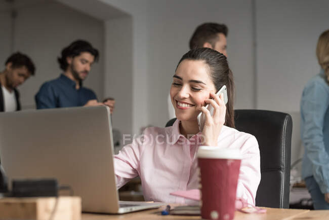 Multi-ethnic business people working in a trendy office — Stock Photo