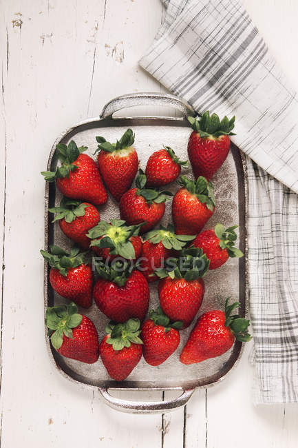 Strawberries in spring on silver plate — Stock Photo